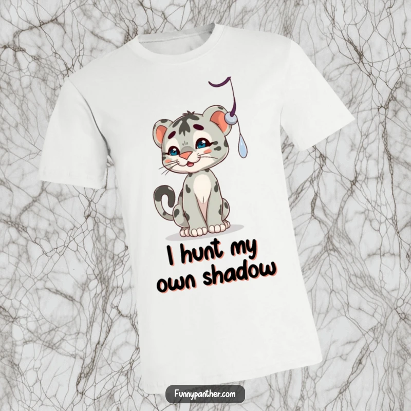 Funny t-shirt showcasing a playful panther cub batting at a dangling shadow, depicting a moment of adorable hunting instinct.