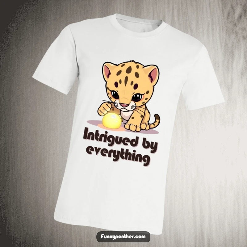 Funny panther cub t-shirt, investigating an intriguing glowing object, showcasing curiosity and humorous exploration.